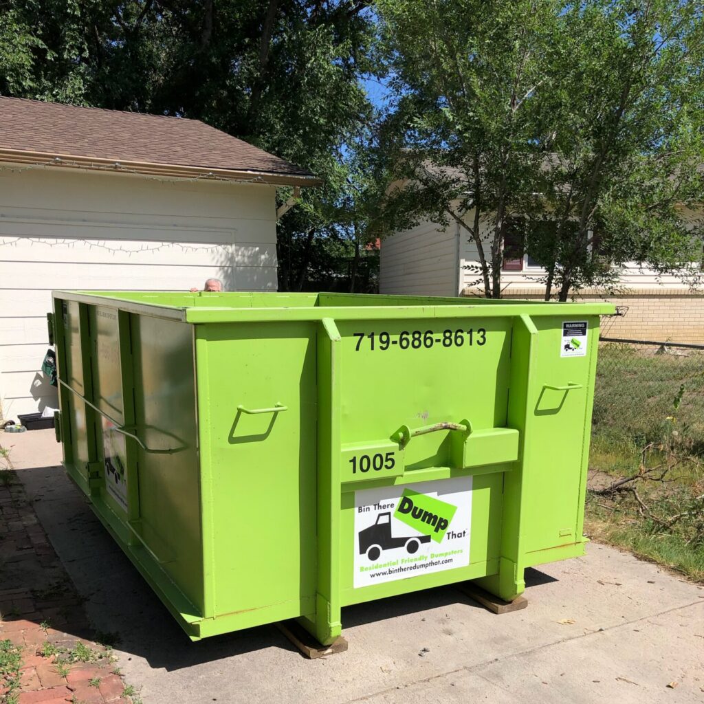 Dumpster in driveway in Colorado Springs