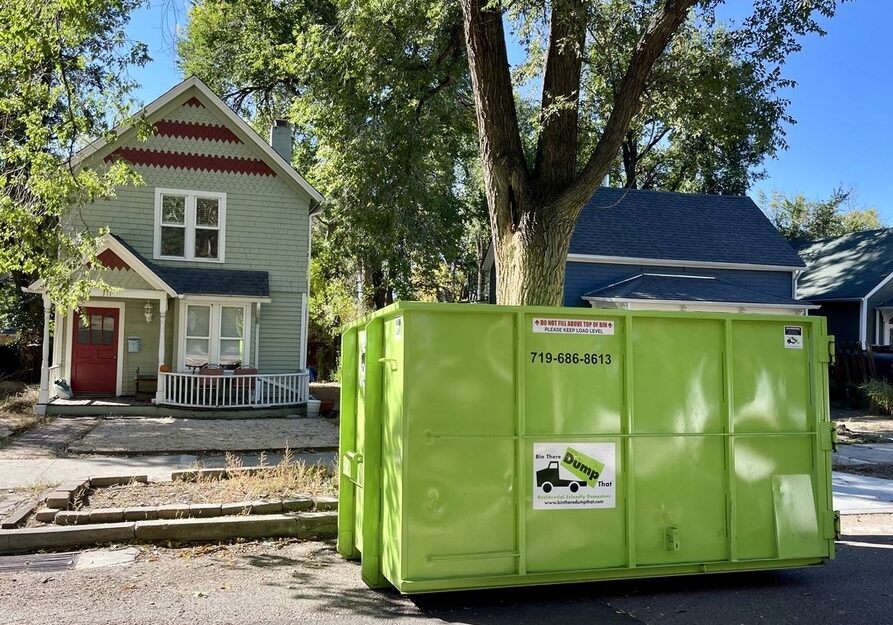 Colorado Springs dumpster rental in a driveway