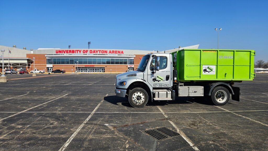 dumpster rental truck in front of university of dayton arena
