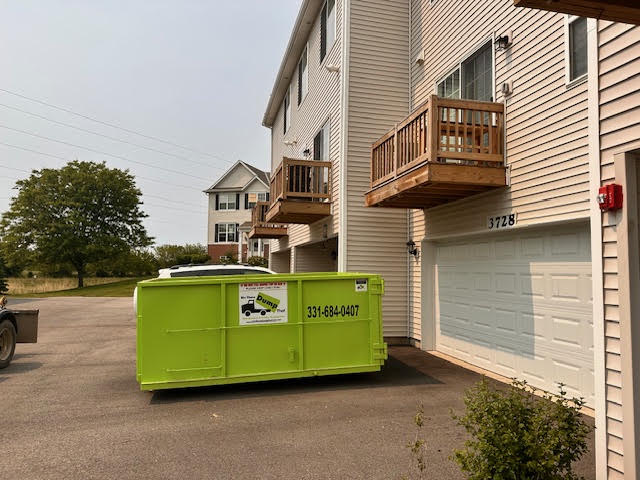 Green Bin There Dump that Dumpster in Plainfield Driveway