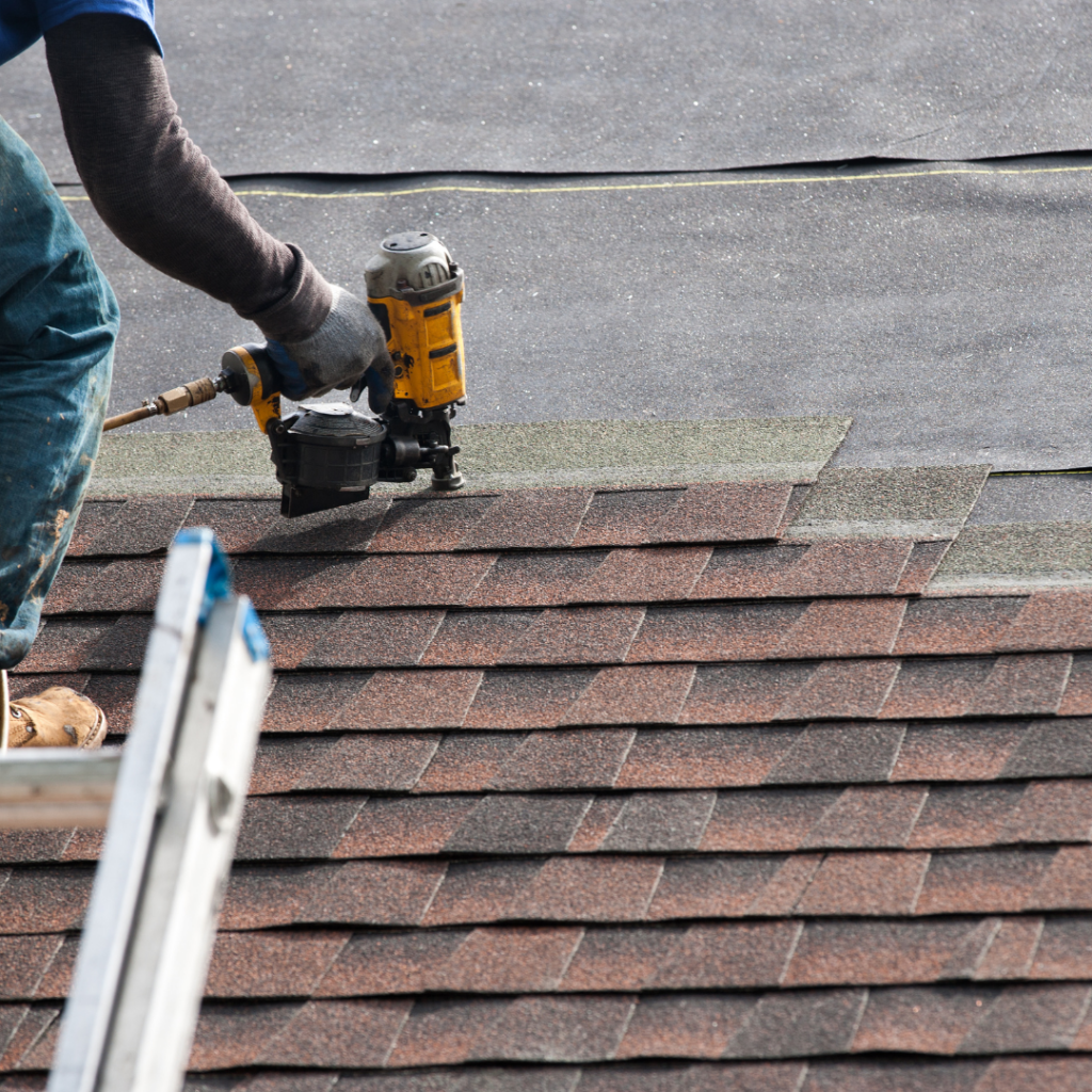 roofer nailing shingles in racine, wi