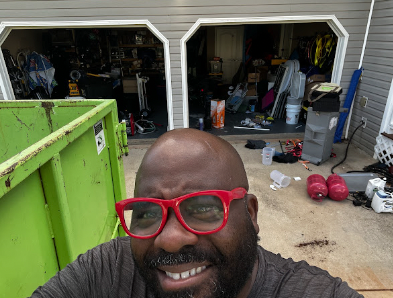 happy Atlanta homeowner cleaned out garage with bin there dump that dumpster rental