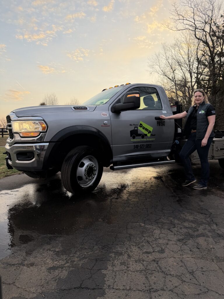 Northern Virginia Bin There Dump That franchise owner standing in front of her dumpster delivery truck